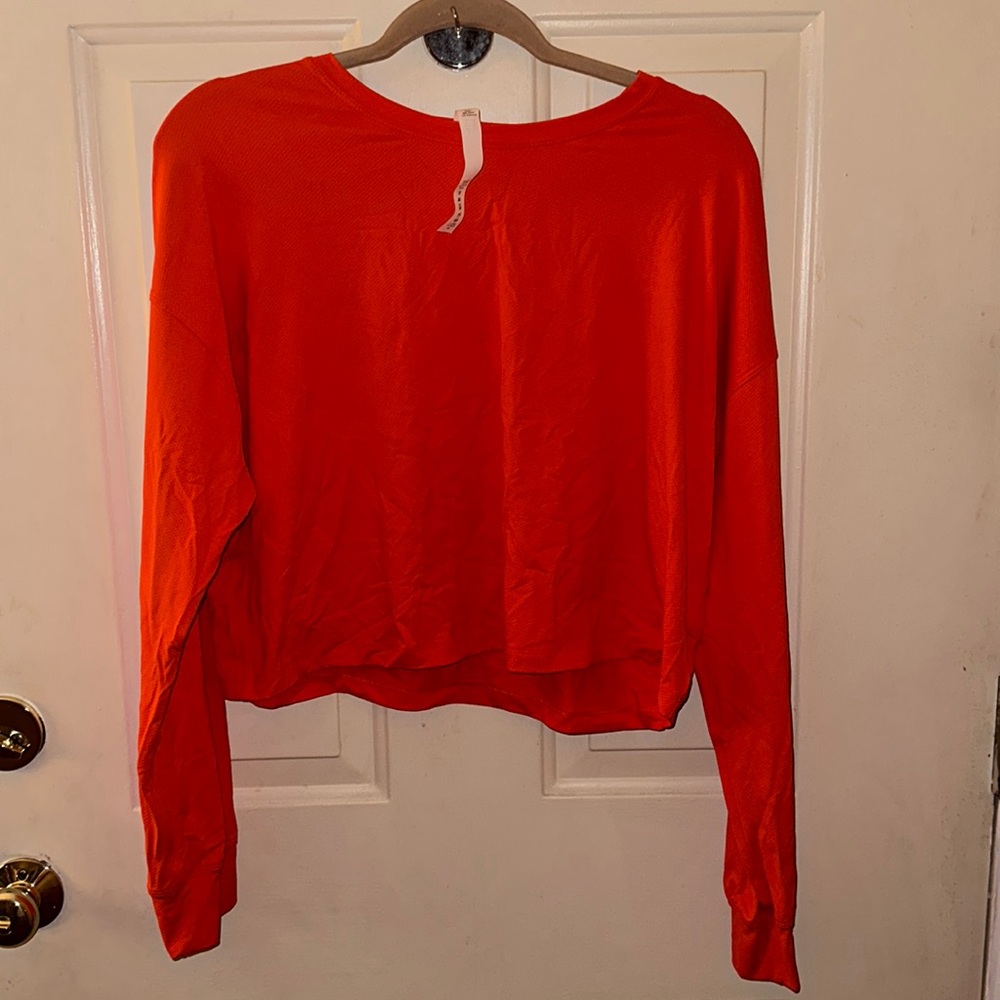 Lululemon cropped workout top. Coral orange